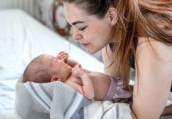 Woman holding her newborn baby