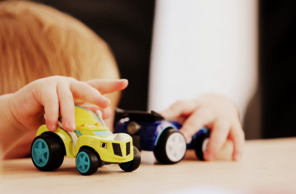 A child playing with kids toys for sale on TopTrendBox.