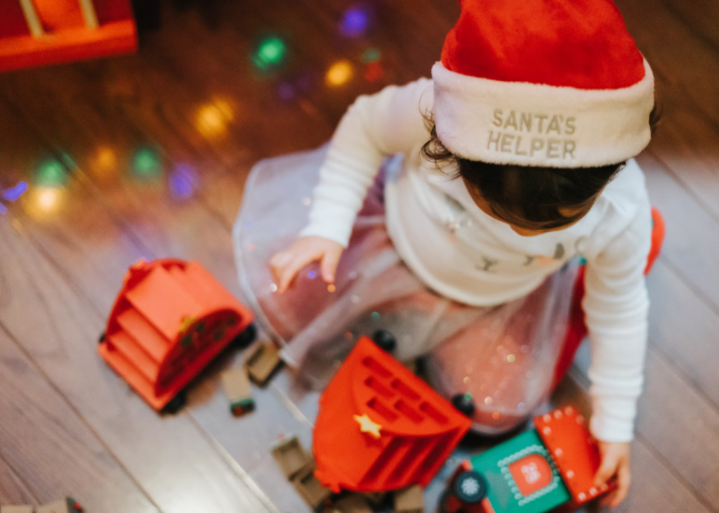 A child playing with toys in a playroom.