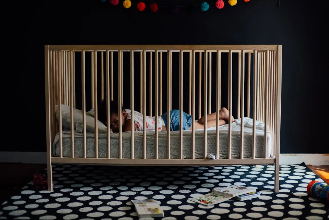A baby in a crib