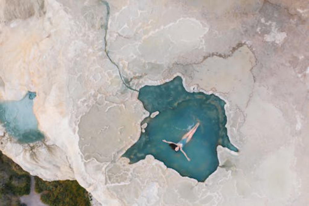 An aerial drone shot of a person in the water