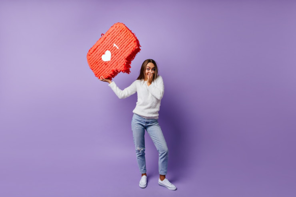 A smiling girl holding a 'like' and 'comment' sign symbolizing customer favorites and top reviewed items.