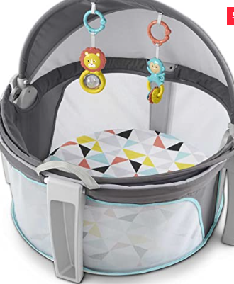 Portable baby dome bassinet with canopy and attached hanging toys.