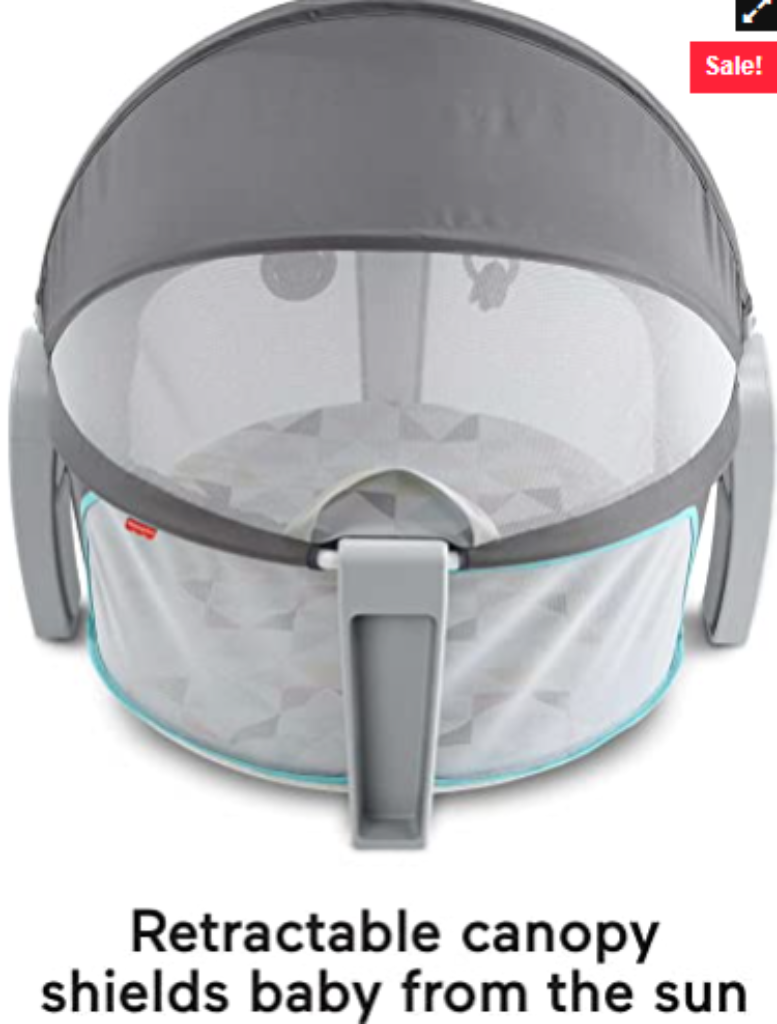 A gray Fisher-Price portable bassinet with mesh sides and a retractable canopy designed to block sunlight.