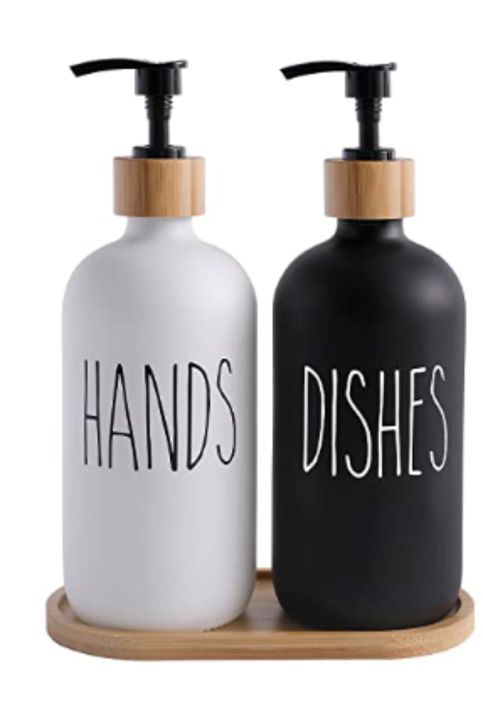 Black and white labeled glass soap dispensers for hand and dish soap.
Caption: Sleek soap dispensers add functional style to kitchen and bathroom spaces.