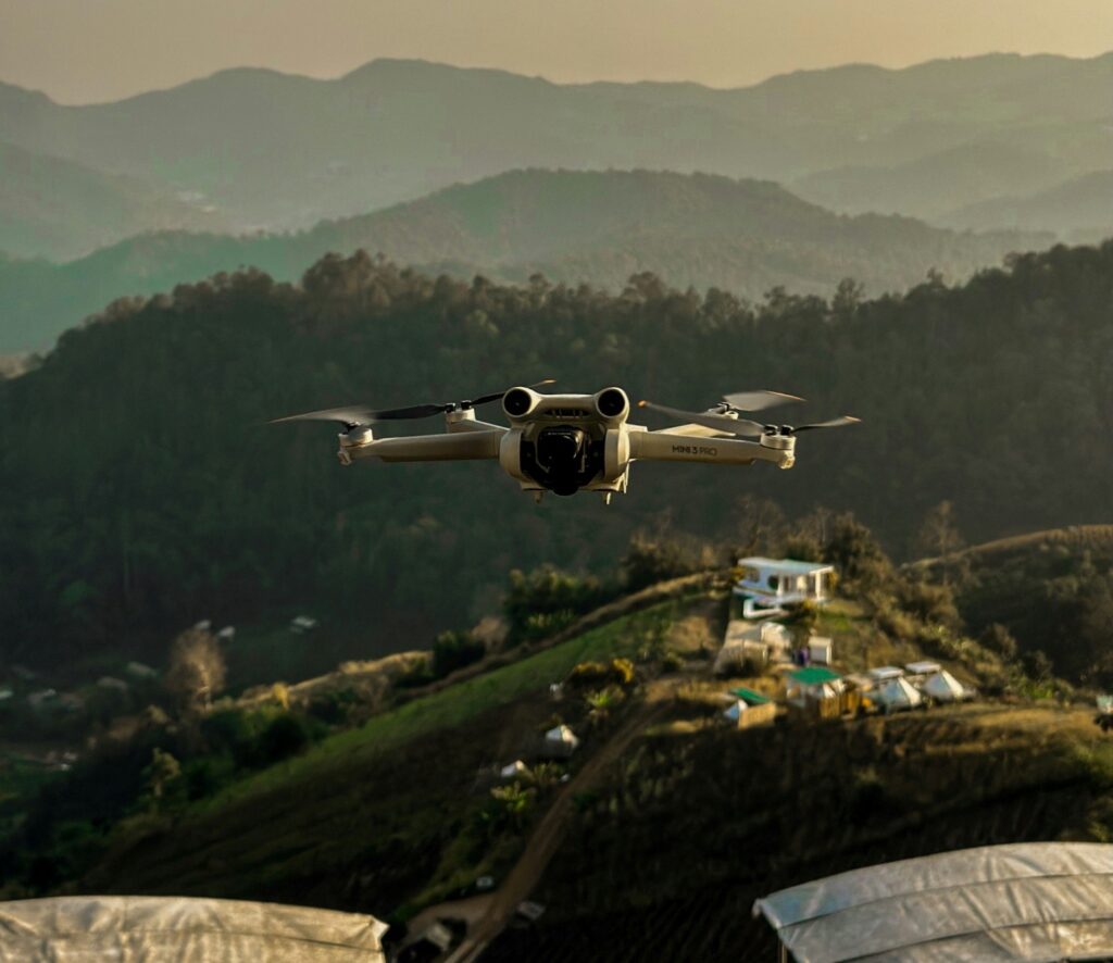 a flying drone capturing a mountain landscape