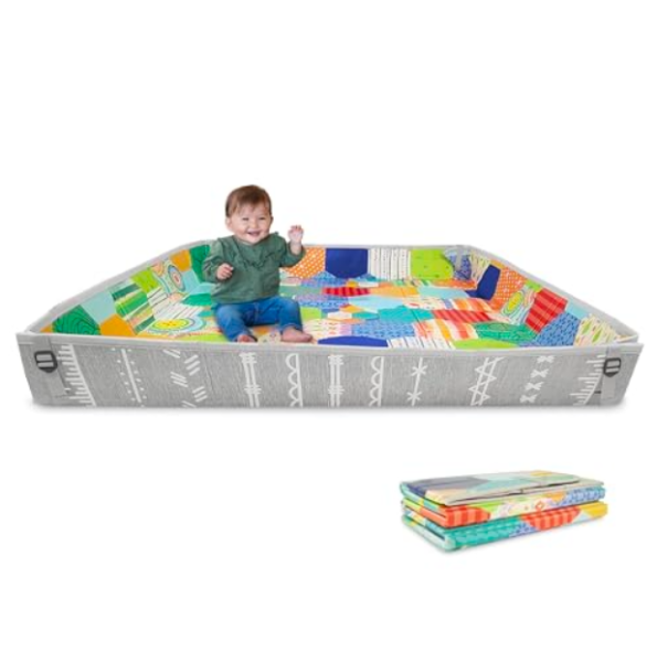 baby on colorful foldable foam play mat