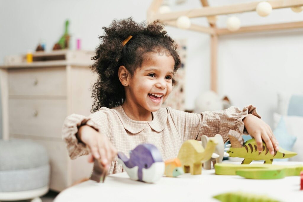 a child happily playing with toys